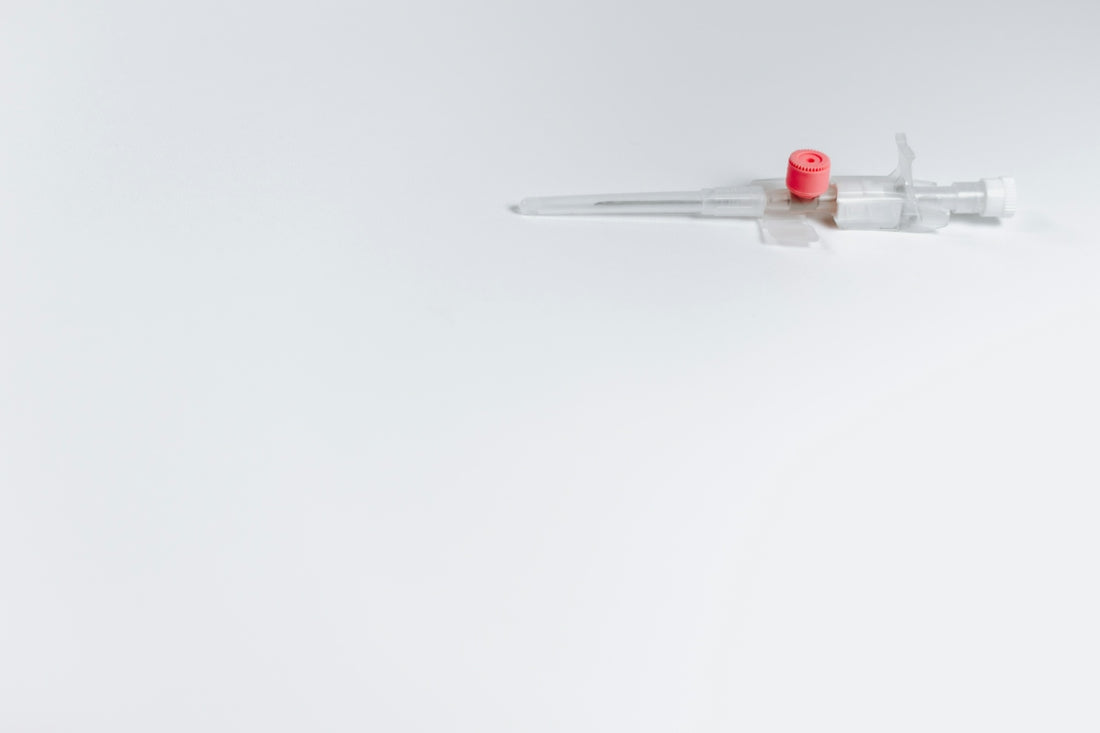 white and red syringe