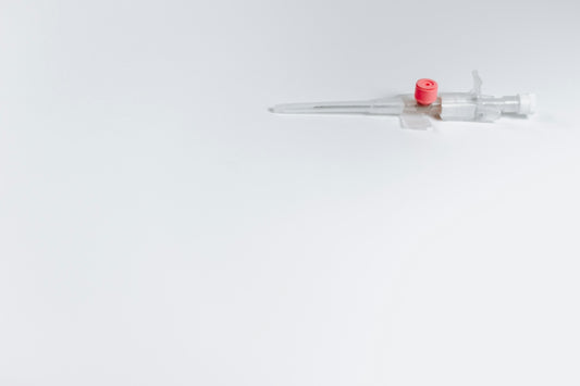 white and red syringe