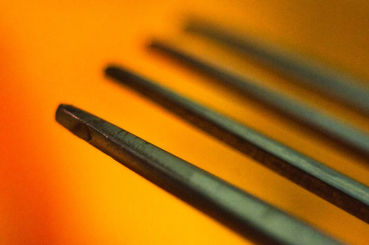 black coated wire on orange surface